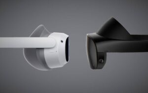 Close-up of a white and a black VR headset side by side, showcasing their design features against a dark background.