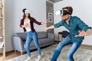 Two individuals wearing virtual reality headsets engage in a lively gaming experience in a modern living room.
