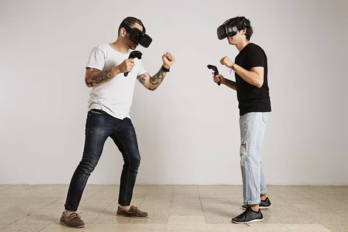 Two individuals engaged in a virtual reality game, wielding controllers and preparing to interact in an immersive gaming environment.