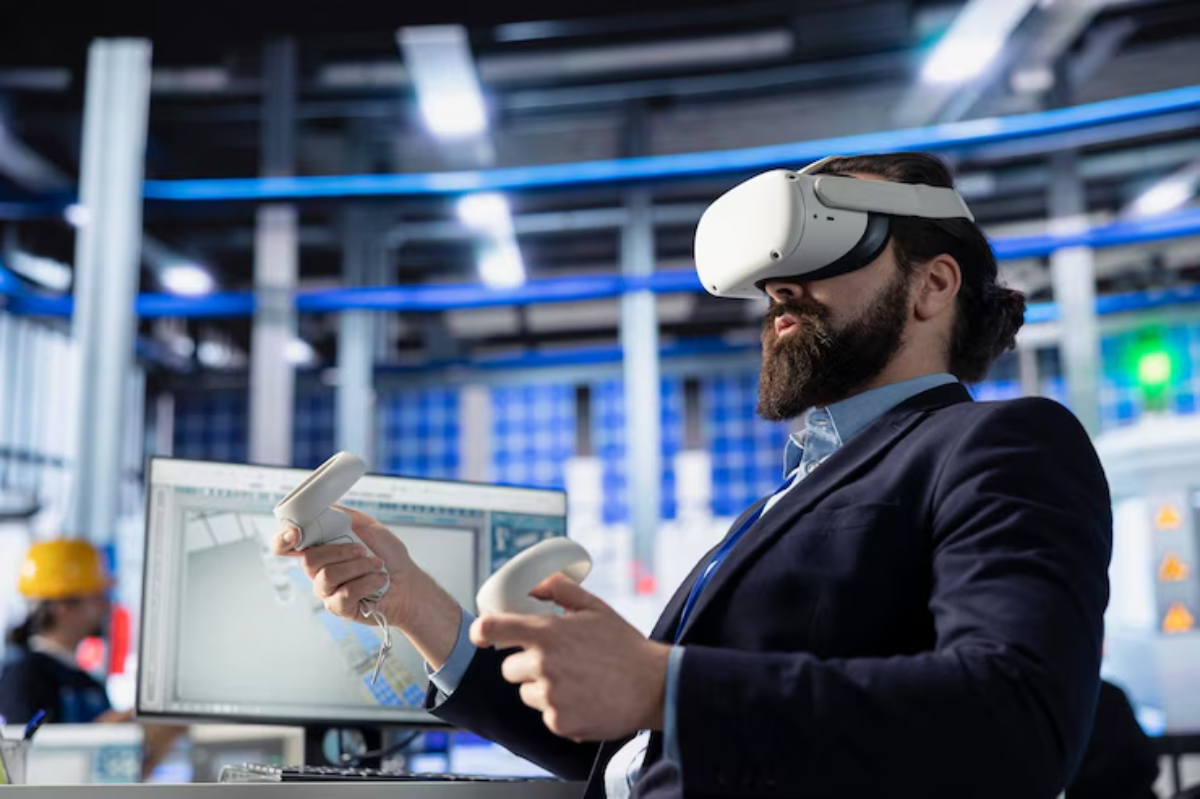A person wears a VR headset, holding controllers, while engaged with a computer displaying a digital design in a modern workspace.
