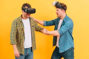 Two individuals wearing VR headsets engage in a friendly interaction against a bright yellow background.