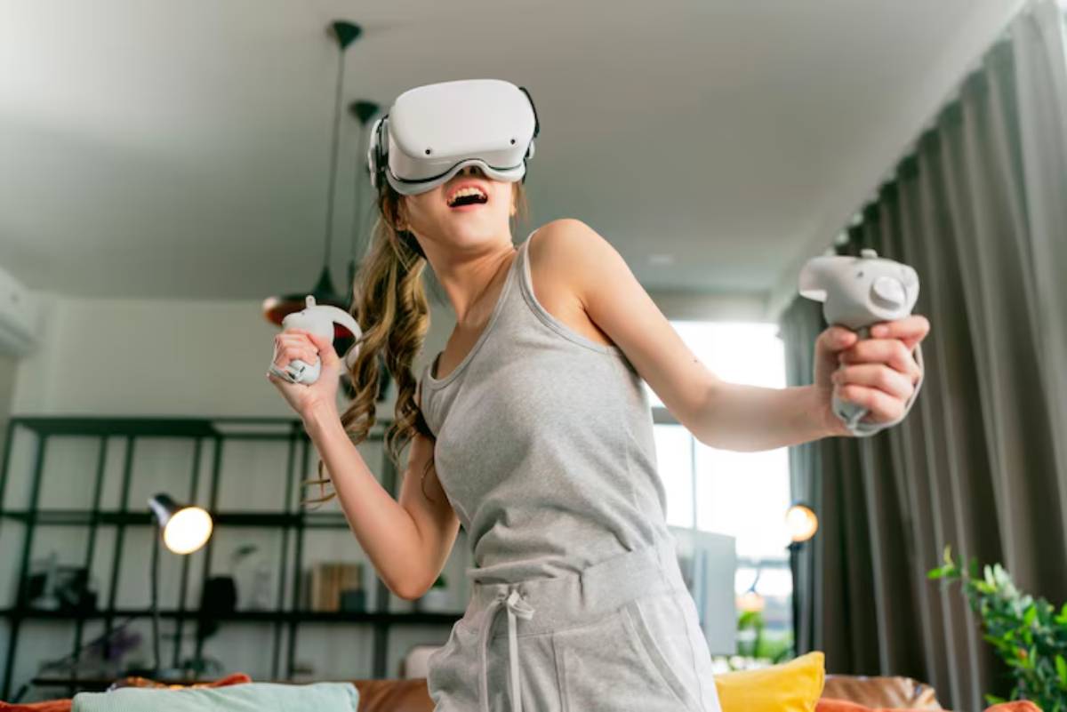 A person wearing a virtual reality headset is holding controllers, immersed in gameplay within a cozy, modern living room.
