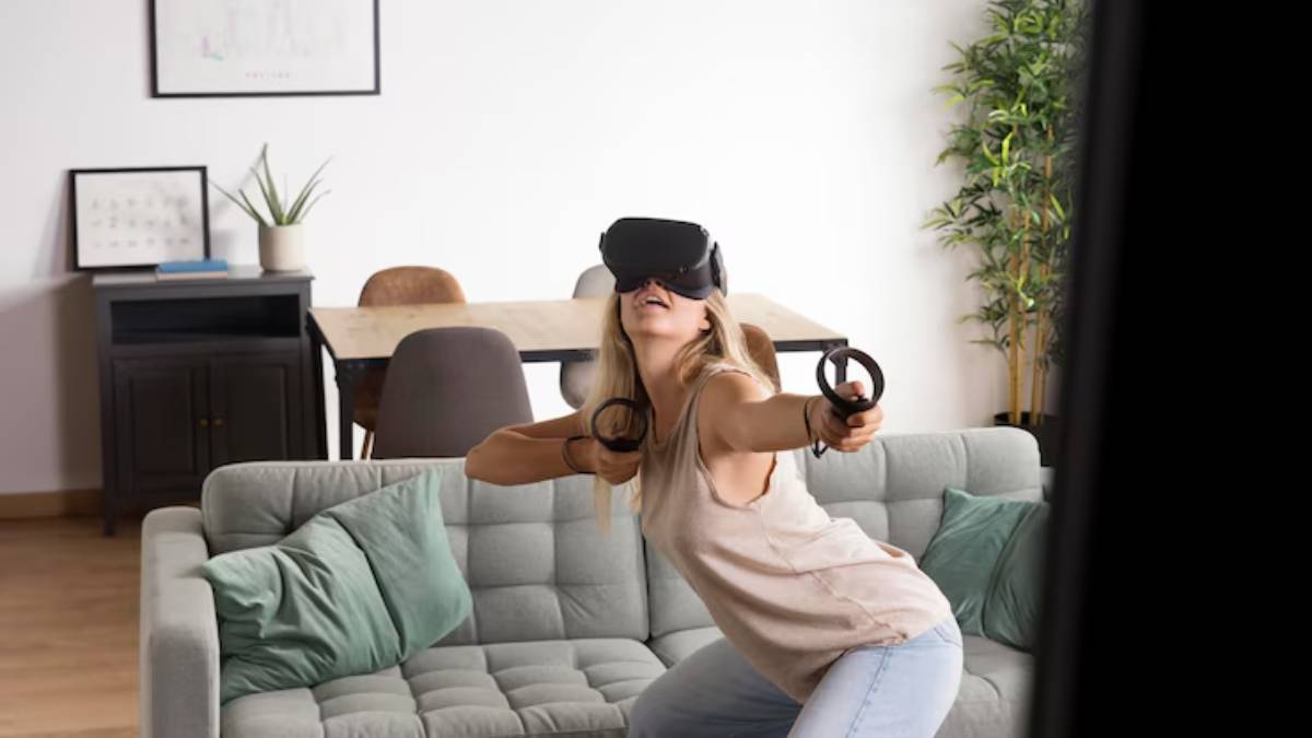 A young woman engaged in virtual reality gaming, wearing a headset and holding controllers, in a cozy living room setting.