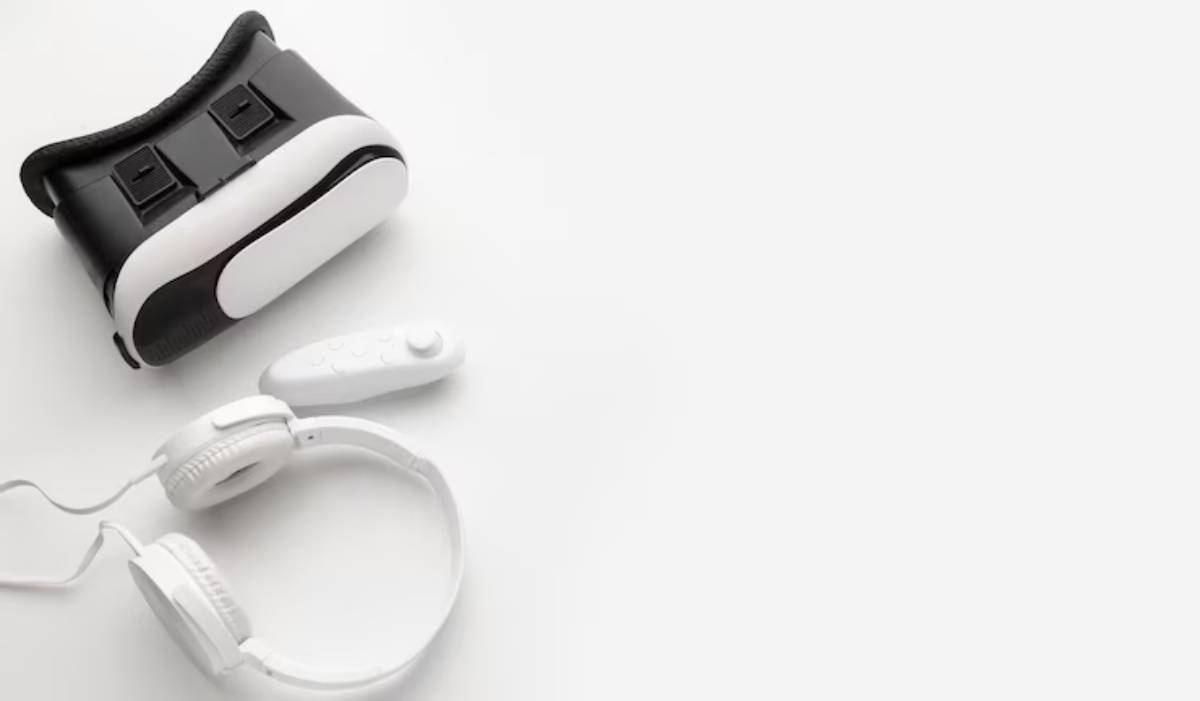 A virtual reality headset with headphones and a remote controller on a white background, showcasing modern gaming technology.