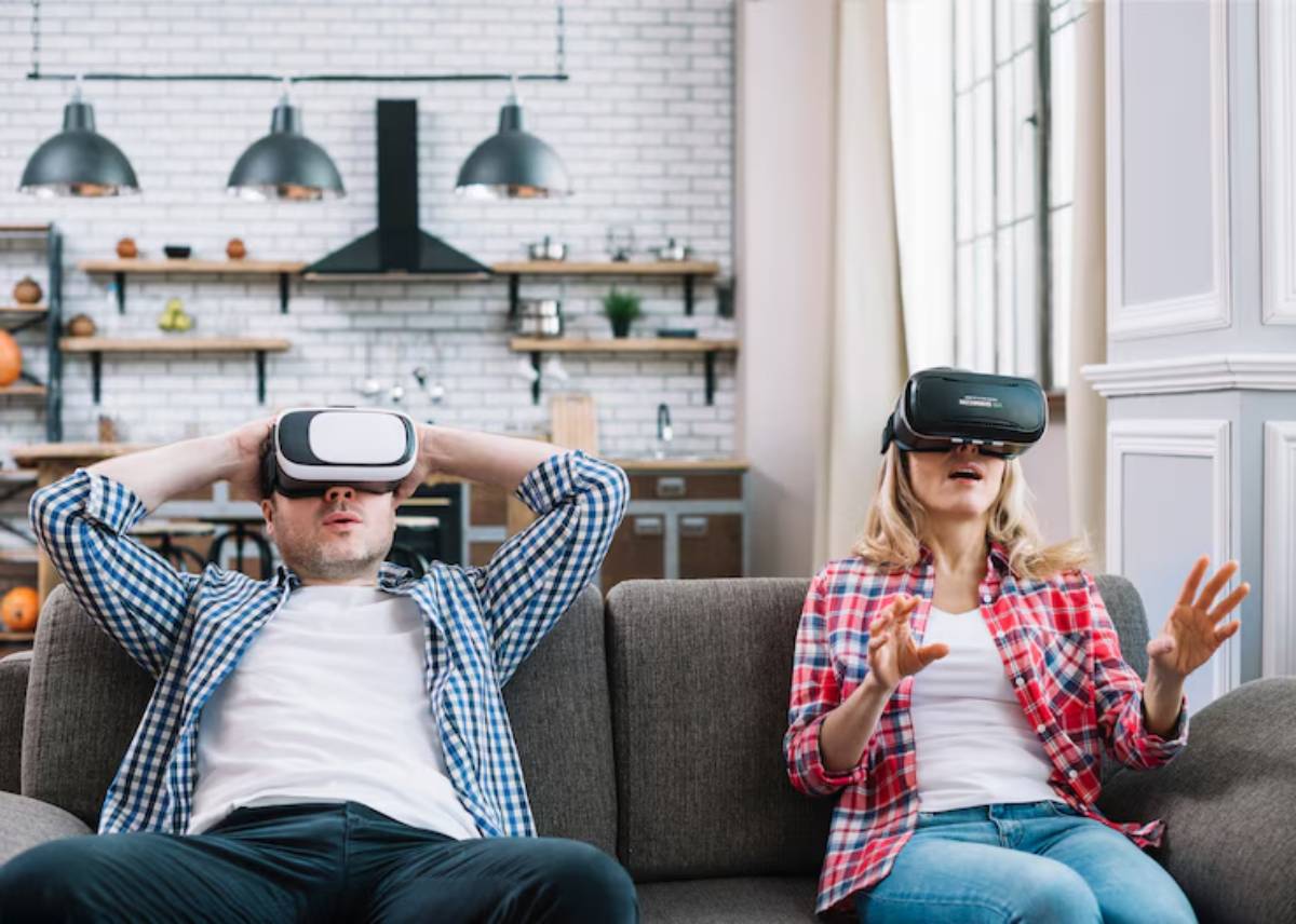 A man and a woman sit on a couch wearing virtual reality headsets, engaged in an immersive experience in a stylish living room.