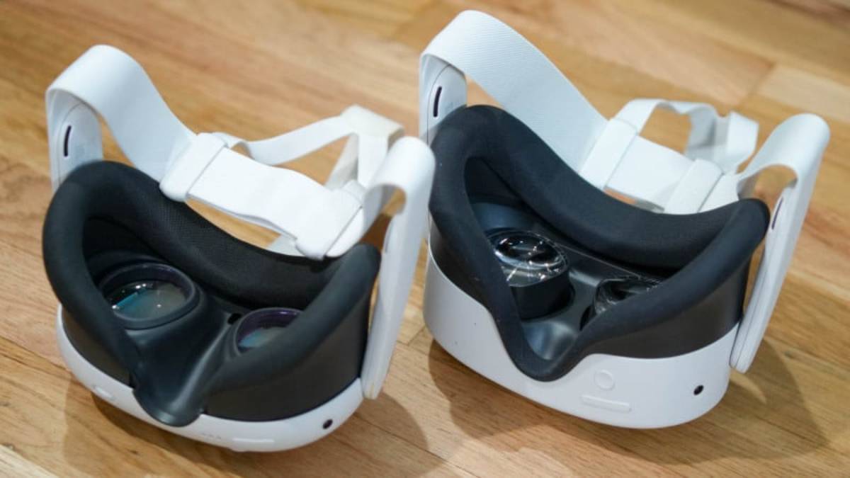 Two VR headsets with white straps resting on a wooden surface, showcasing their sleek design and lens interiors.