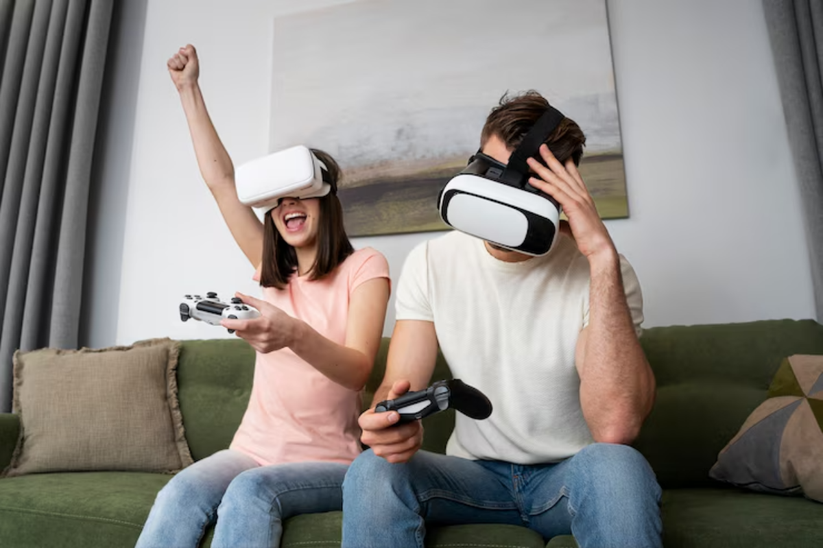 A person wearing a VR headset celebrates while another, also with a headset, looks stressed, sitting on a green couch in a modern living room.