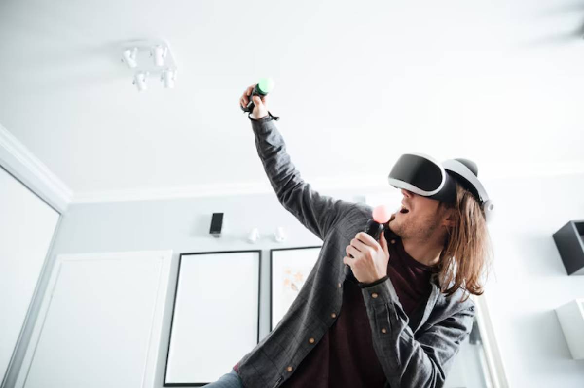 A person wearing a VR headset engages enthusiastically with motion controllers in a well-lit, modern living space.